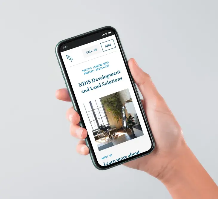 A mockup of a hand holding an iPhone 10 with the Perth SDA Property website on it.