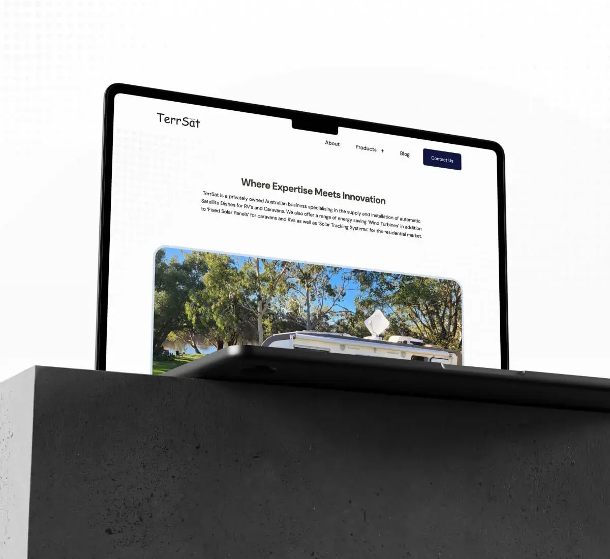 A photo of a laptop mockup with the TerrSat website featured inside of it.